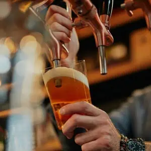 Draft beer being poured into a glass