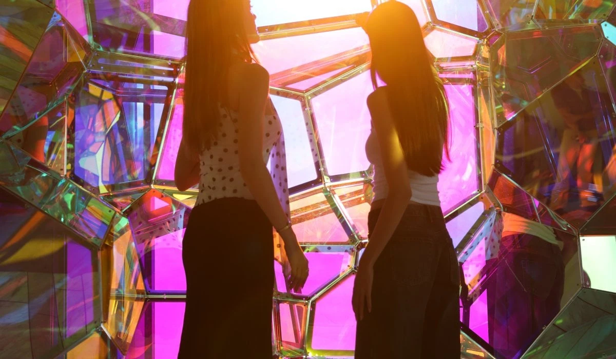 Group of guests moving through Crystal Cave, an immersive installations at Edge NYC before stepping onto the outdoor sky deck
