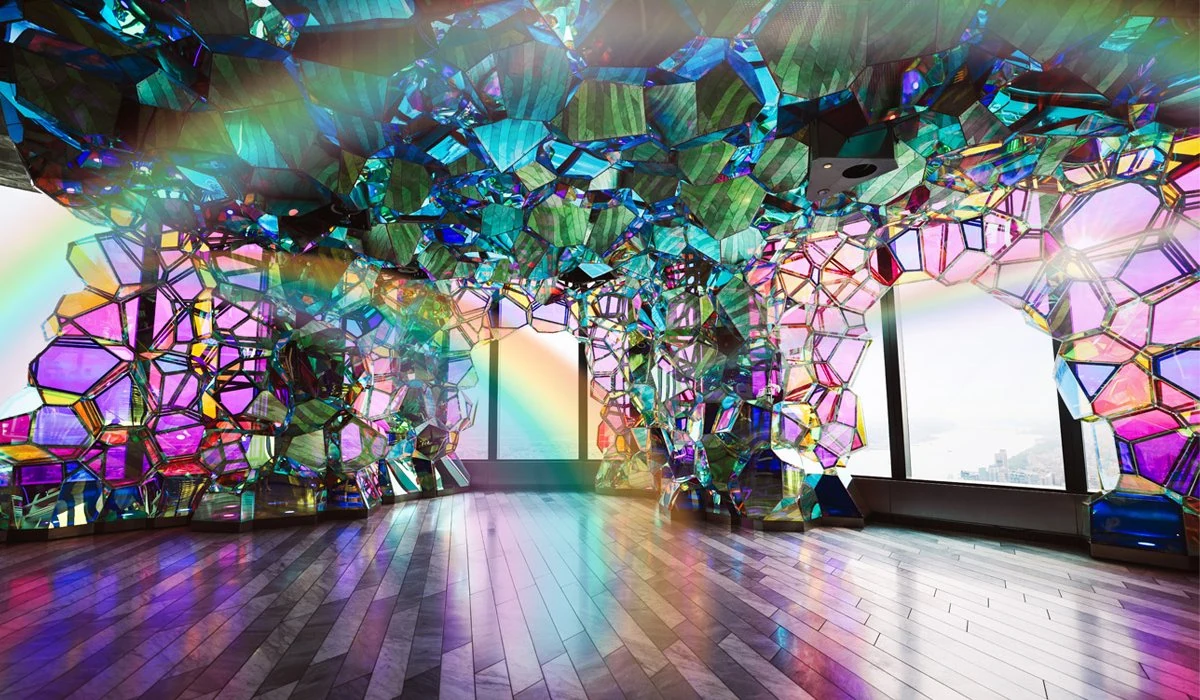 Colorful, reflective glass art installation at Edge NYC sky deck with city views.