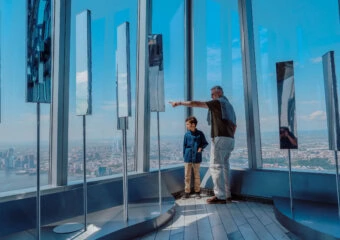 Visitors enjoying panoramic skyline views from Edge NYC sky deck at Hudson Yards.