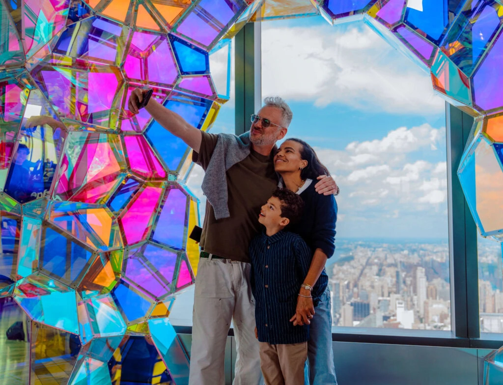 Edge NYC Sky Deck Family View - Edge NYC - Edge NYC Family enjoying panoramic NYC skyline from Edge NYC sky deck with colorful art installation.
